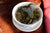 pu-erh tea leaves brewing in a gaiwan